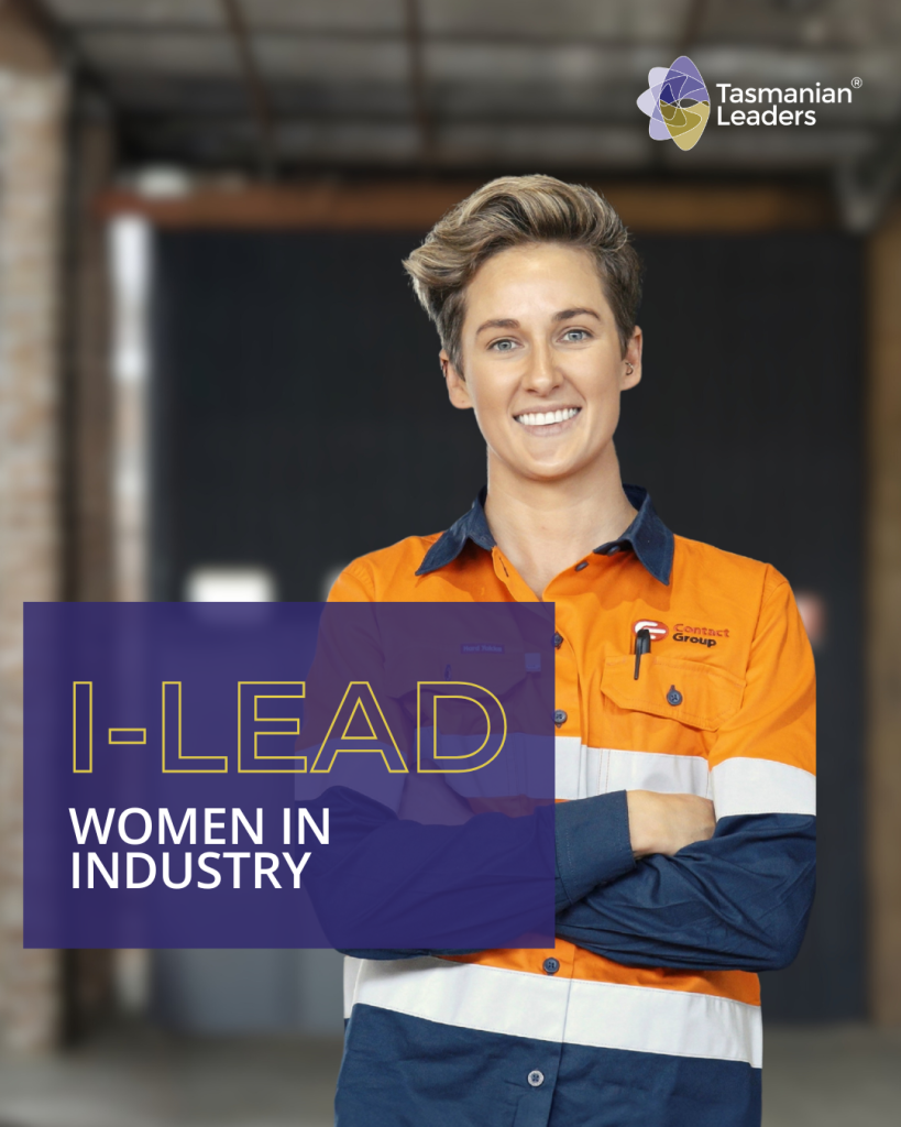 a young woman with short hair faces the camera in a relaxed pose, arms crossed and smile on her face