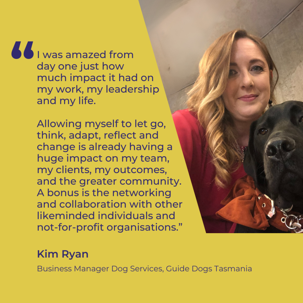 Image of a woman cuddling an off-duty guide dog