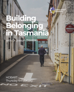 image of a man walking away from the viewer, in a long laneway